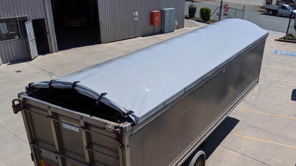 WATERPROOF HOOD TARP SYSTEMS Retractable Tarps